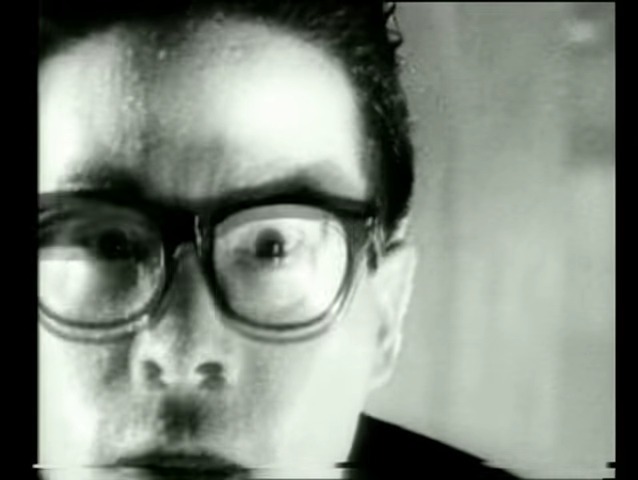 A screenshot from Japanese horror movie Tetsuo: The Iron Man (1989).