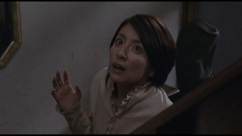 A screenshot from Japanese horror movie Ju-On: The Grudge (2002)