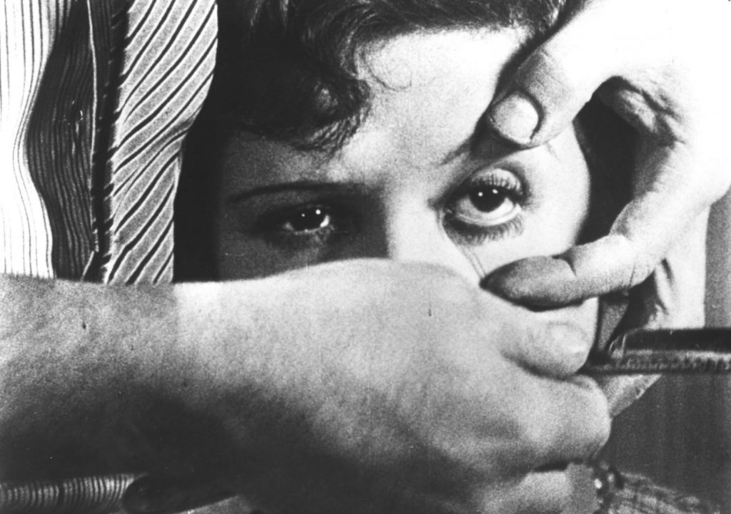 A screenshot from French horror movie Un Chien Andalou (1929)