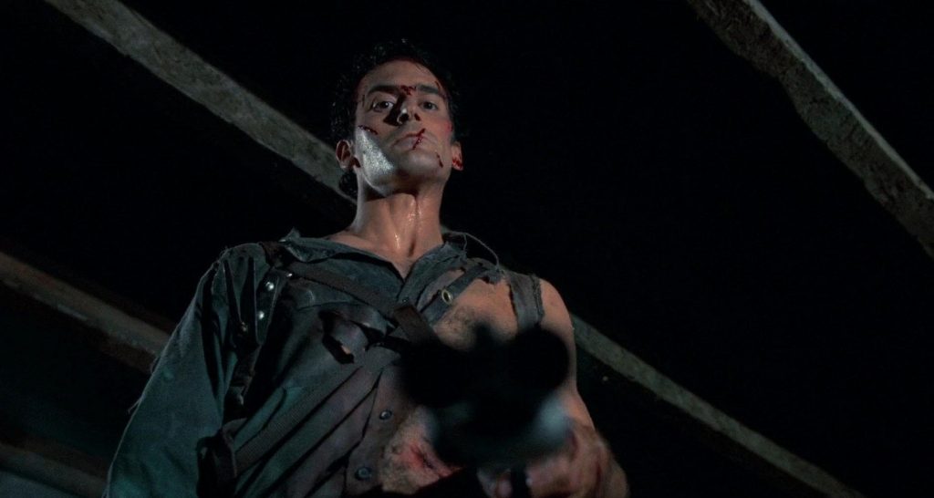 A screenshot from horror comedy movie Evil Dead 2 (1987)